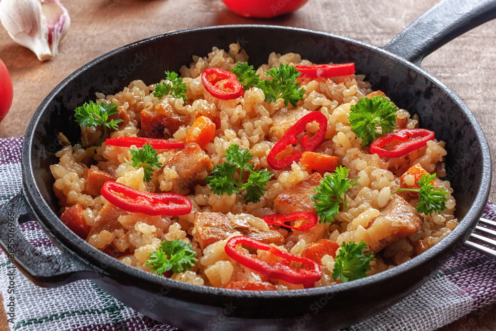 Rice with meat, vegetables and parsley in a serving pan Rice with meat, vegetables and parsley in a serving pan