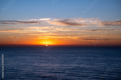 Sunrise over the Southern Ocean from Bird Rock Lookout, Torquay, Victoria, Australia photo