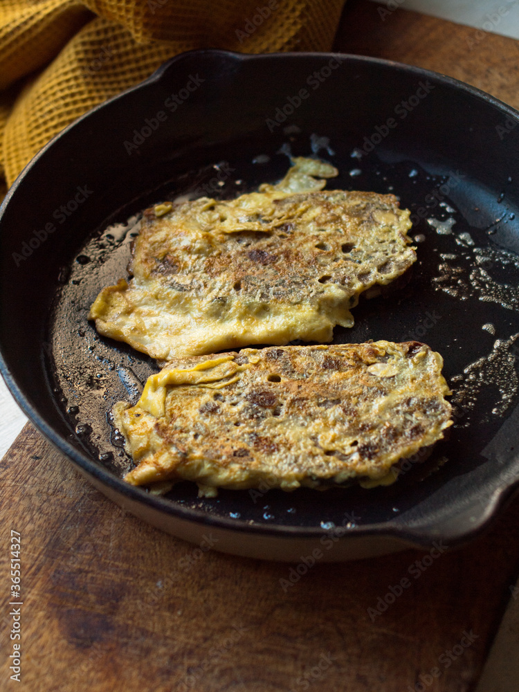 Rustic french toast in cast iron pan.