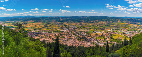 A panorama view from the top of the Colle Eletto cable car over the city of Gubbio  Italy towards the Apennine mountains in summer