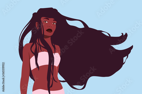 Portrait of a beautiful relaxed adult girl in a swimsuit
