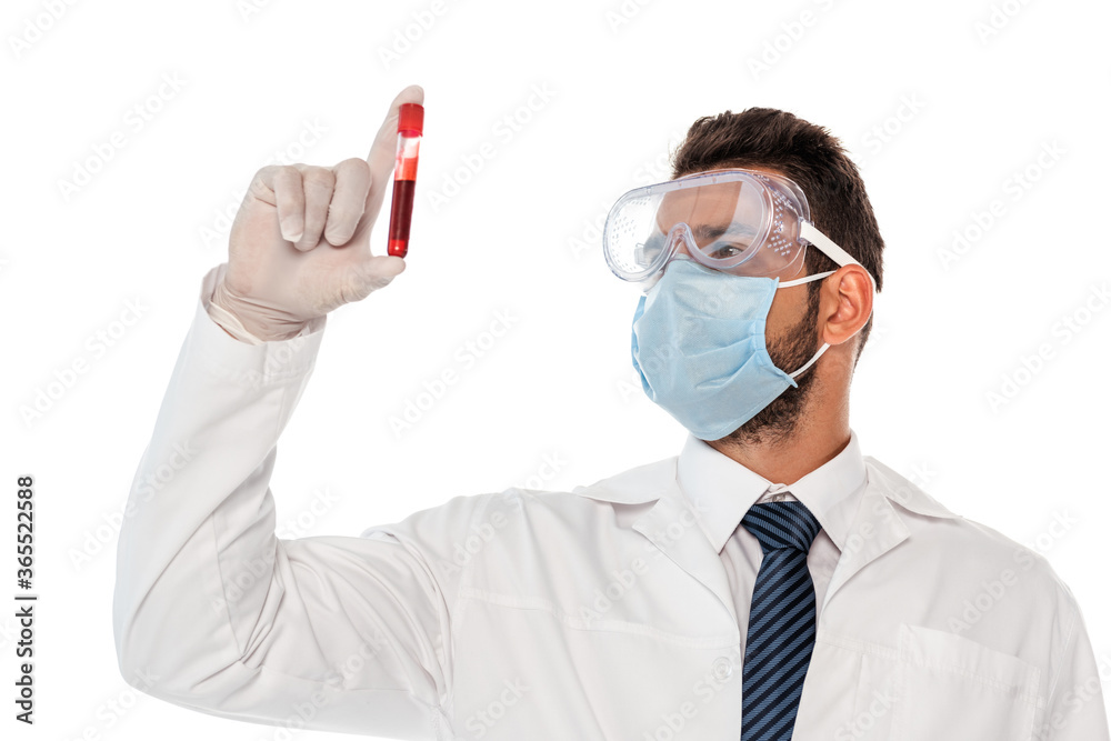 Doctor in medical mask and protective goggles holding test tube with blood sample isolated on white Doctor in medical mask and protective goggles holding test tube with blood sample isolated on white