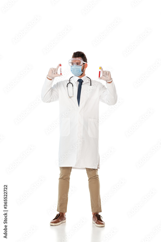 Doctor in safety goggles and mask holding test tubes with blood samples on white background Doctor in safety goggles and mask holding test tubes with blood samples on white background