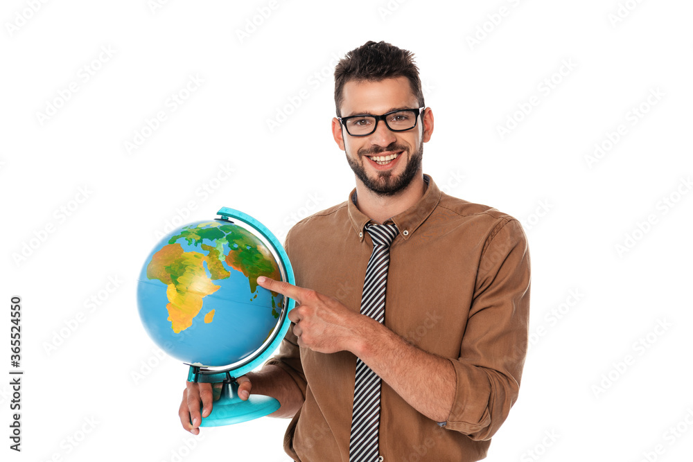Bearded teacher smiling at camera while pointing with finger at globe isolated on white Bearded teacher smiling at camera while pointing with finger at globe isolated on white