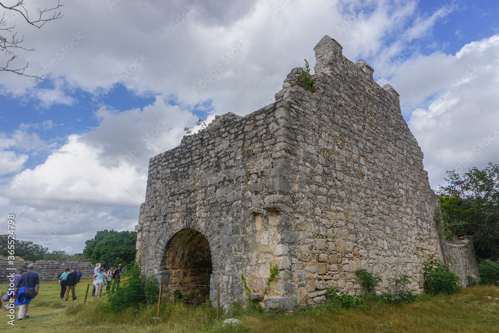 Dzibilchaltun, Yucatan, Mexico: Tourists visit the ruins of a Spanish mission church built c. 1590-1600 from the stones of Mayan structures.