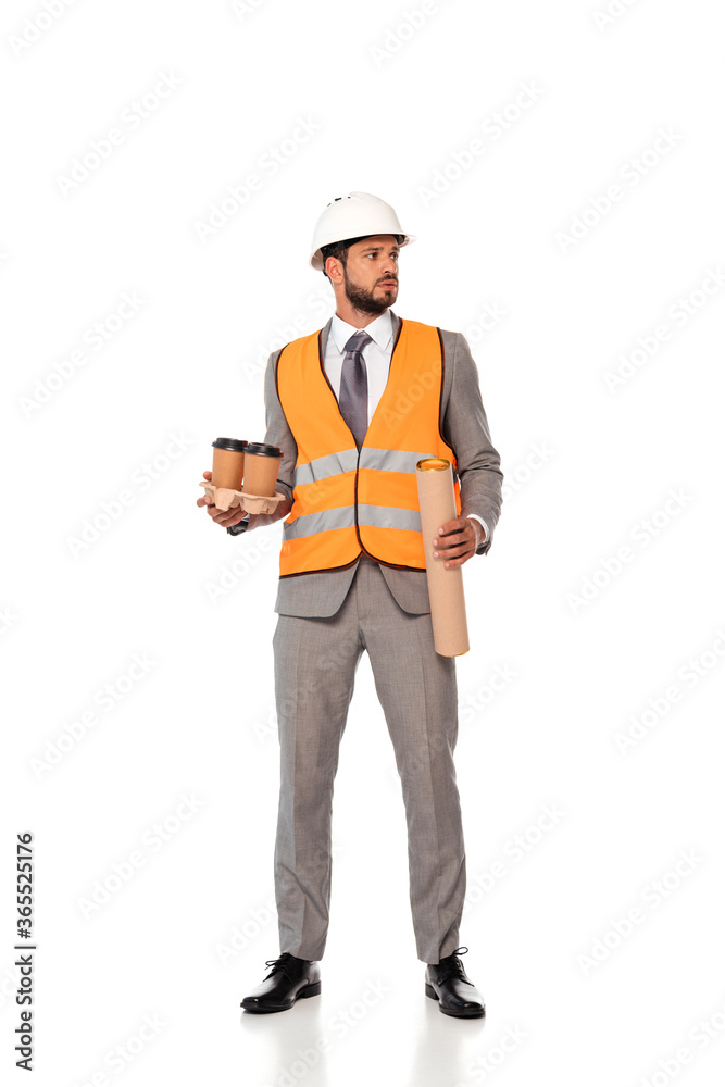 Engineer in suit and hardhat holding paper cups and blueprint tube on white background Engineer in suit and hardhat holding paper cups and blueprint tube on white background