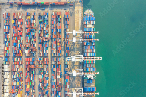 Container , container ship in export and import business and logistics. Shipping cargo to harbor by crane. Water transport International. Aerial view and top view.