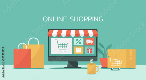 online shopping concept on computer, e-shopping and e-commerce, online digital store with shopping cart and goods, vector flat graphic illustration