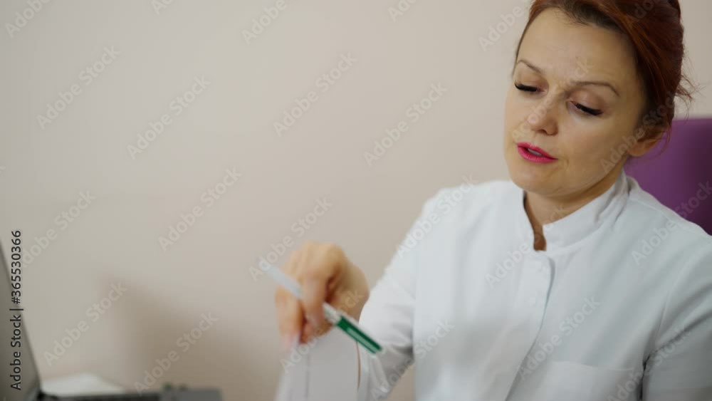 Doctor explaining the diagnosis. Female medical specialist in white coat sitting in chair and talking about the test results in clinic. Doctor explaining the diagnosis. Female medical specialist in white coat sitting in chair and talking about the test results in clinic.