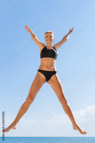 Girl doing exercises outdoors