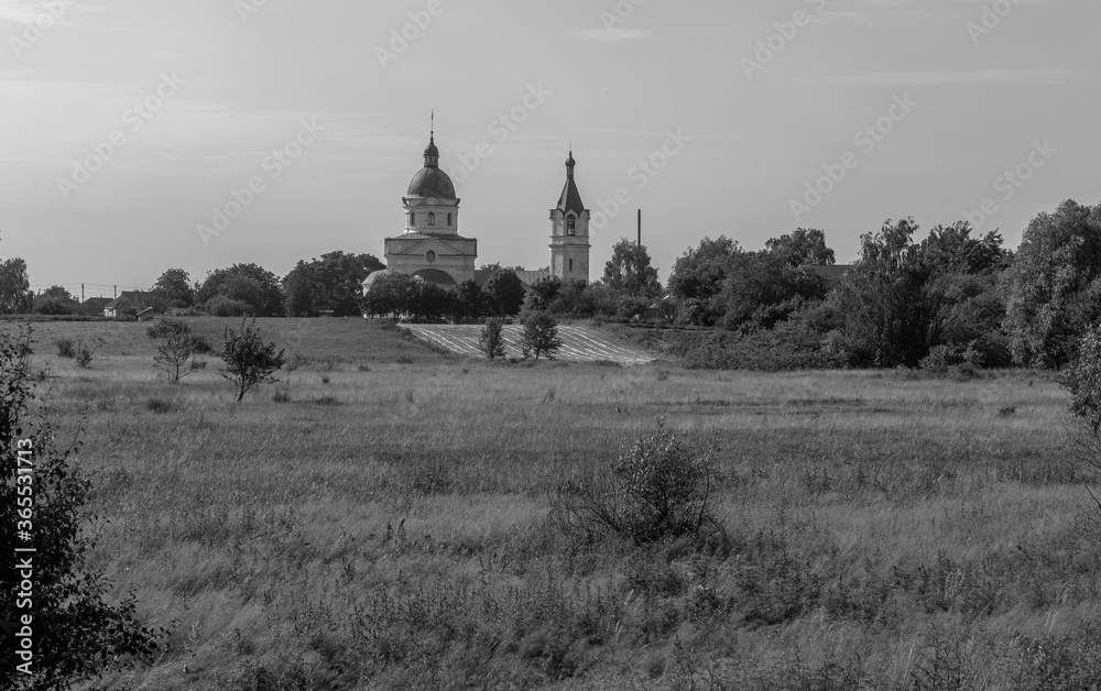 Beautiful summer rural landscape with Christian church.