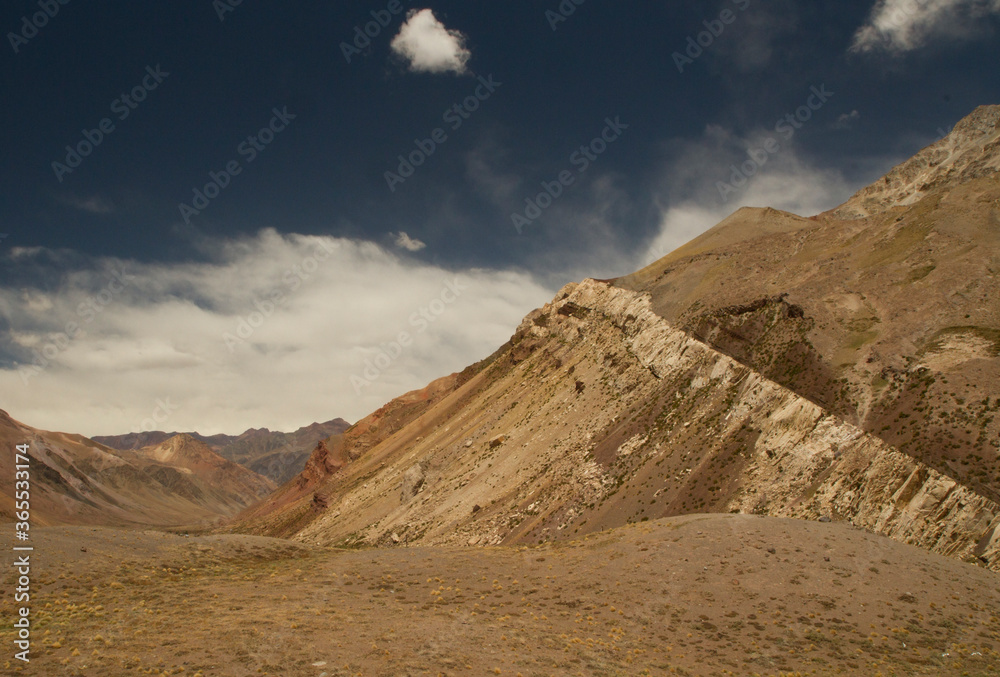 Geology. The beautiful valley, yellow meadow, mountains and rocky formations. 