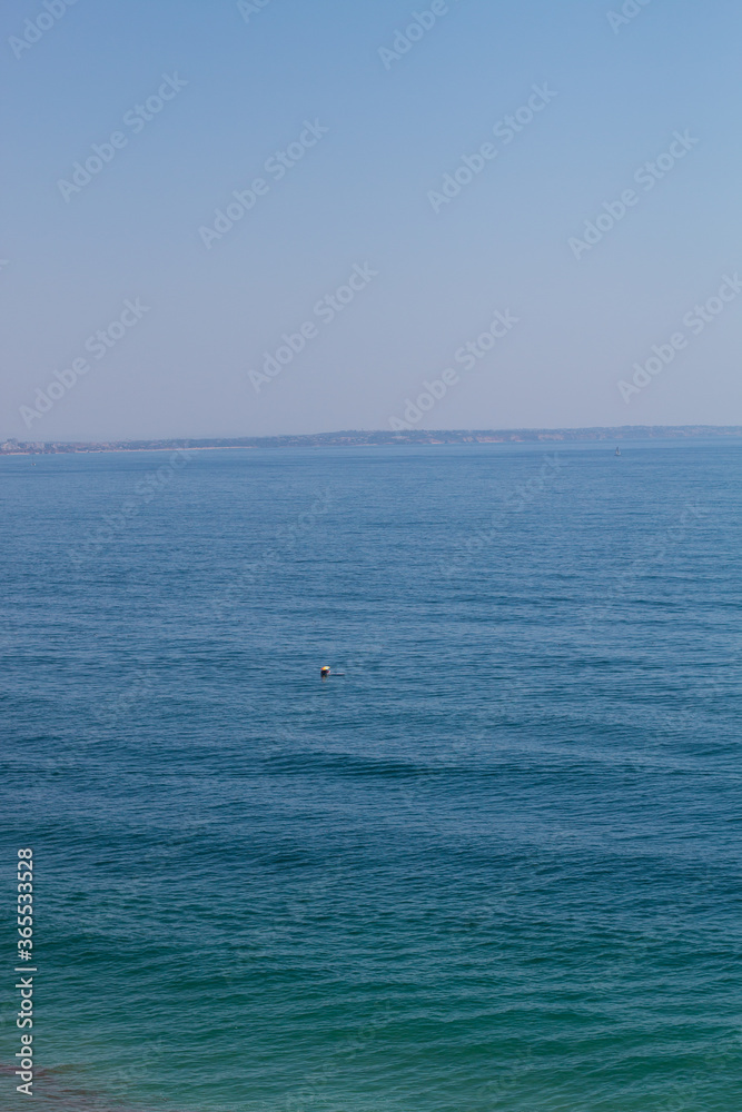 Algarve, Lisbon. Beautiful bay near Lagos town with high cliffs on the shore of the Atlantic Ocean. The Algarve is the southernmost region of continental Portugal. 