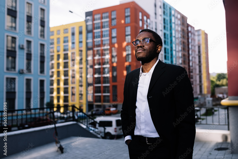 Portrait of a serious african american man in city center surrou Portrait of a serious african american man in city center surrou