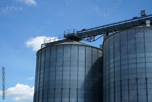 An old rusted silo photographed in a port area in summer