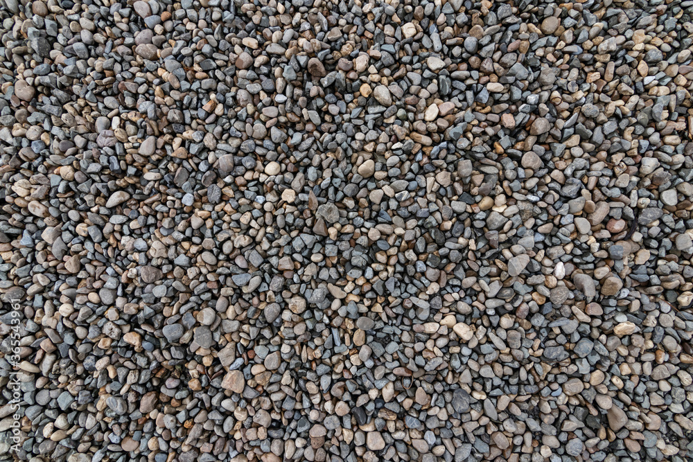 Top view of the pebbles stone on the floor. beautiful small stone on the beach background texture. Top view of the pebbles stone on the floor. beautiful small stone on the beach background texture.