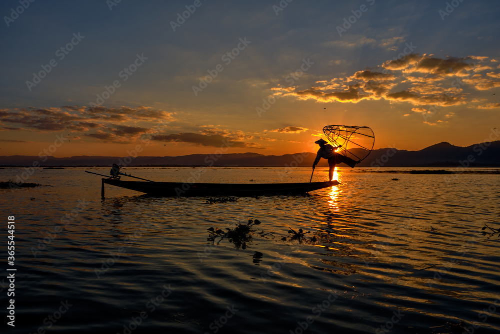INLE, MYANMAR - JANUARY 27, Myanmar Inle Lake Burmese Fisherman On Boat Catching Fish By Traditiona. January 27, 2017. INLE, MYANMAR - JANUARY 27, Myanmar Inle Lake Burmese Fisherman On Boat Catching Fish By Traditiona. January 27, 2017.