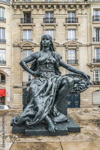 Statues near the entrance to D'Orsay Museum. Statues of six continents in cast iron, formerly gilded, commissioned for Universal Exhibition of 1878. Paris, France.