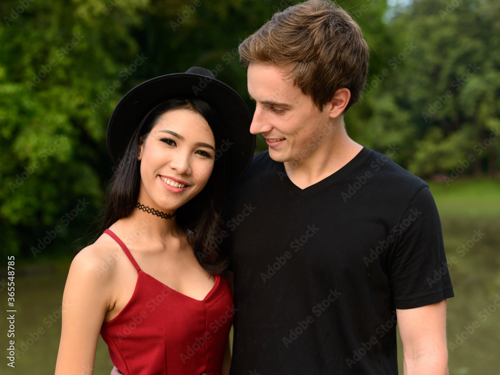 Portrait of multi ethnic couple together and in love at the park Portrait of multi ethnic couple together and in love at the park