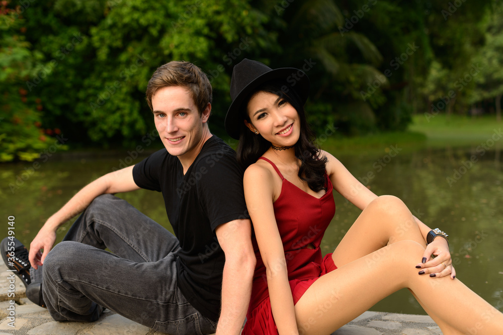 Portrait of multi ethnic couple together and in love at the park Portrait of multi ethnic couple together and in love at the park