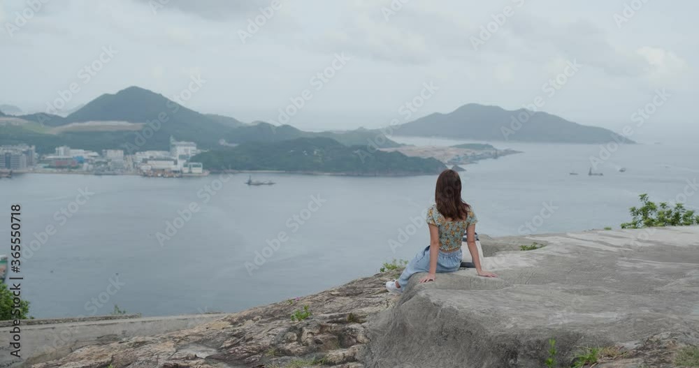 Woman sit at the top of the hill Woman sit at the top of the hill