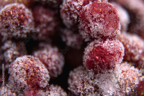 lots of frozen berries. wild strawberry. close up.