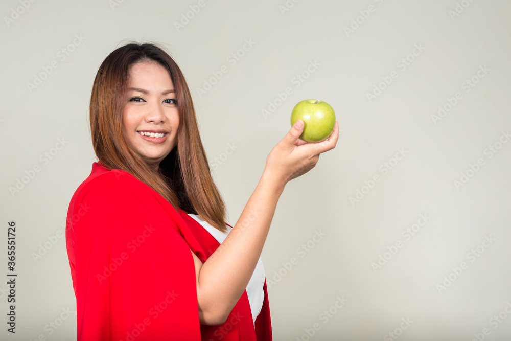 Portrait of young beautiful overweight Asian businesswoman Portrait of young beautiful overweight Asian businesswoman