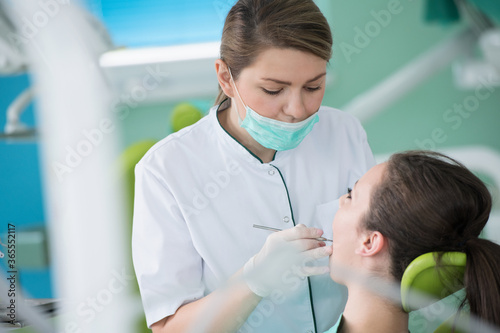 Dentist and patient in dentist office
