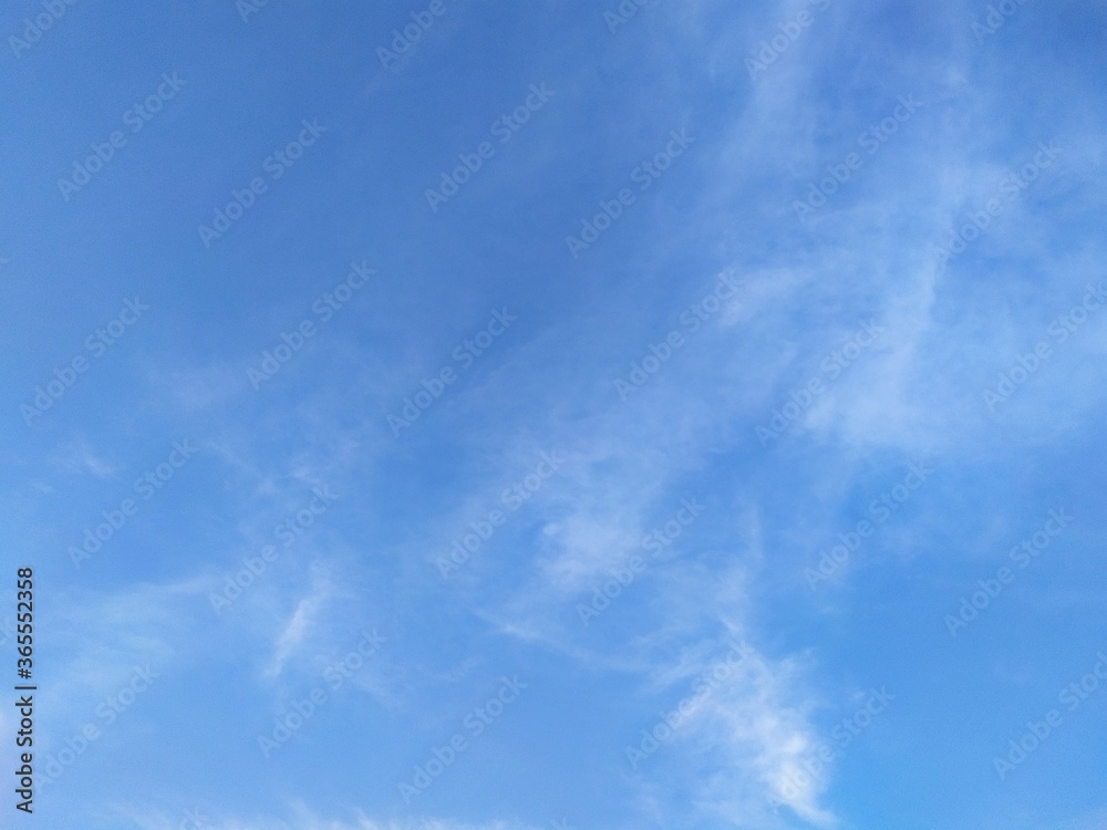 Cottony white clouds in blue sky Cottony white clouds in blue sky