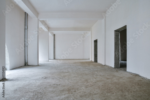 Unfinished building interior, white room.Repairs in the apartment. Preparing in the commercial object