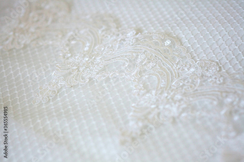 Lace and embroidery with beads on fabric