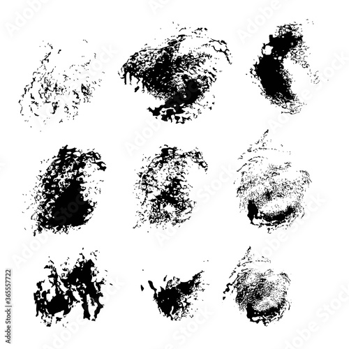 Abstract texture smears of black paint spots on white paper