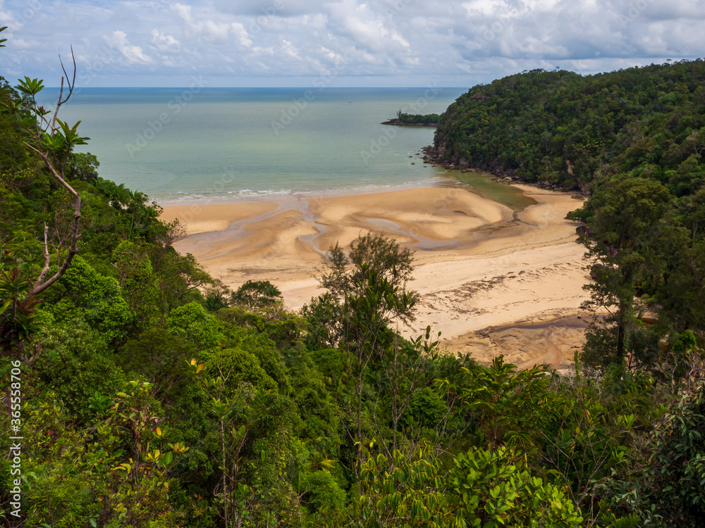 Beach surrounded by rainforest in Bako National Park, Sarawak, Malaysia Beach surrounded by rainforest in Bako National Park, Sarawak, Malaysia