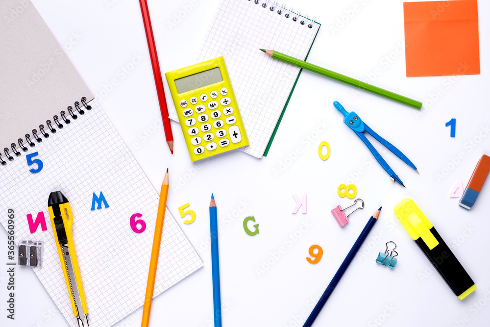 Many different school supplies on white copy space background. Back to school concept. Many different school supplies on white copy space background. Back to school concept.