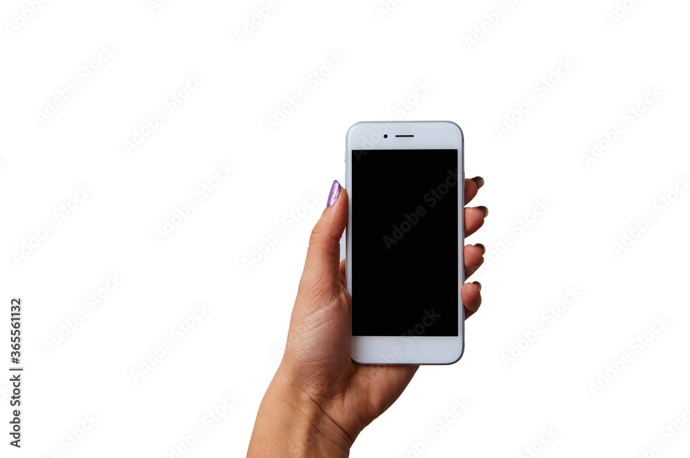 Modern smartphone with blank screen lying flat on coffee table beside some brownies, coffee cup and a notebook