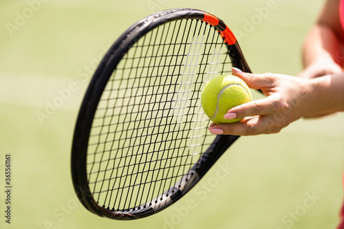 Close up of a tennis player hitting the ball with racket © Angelov