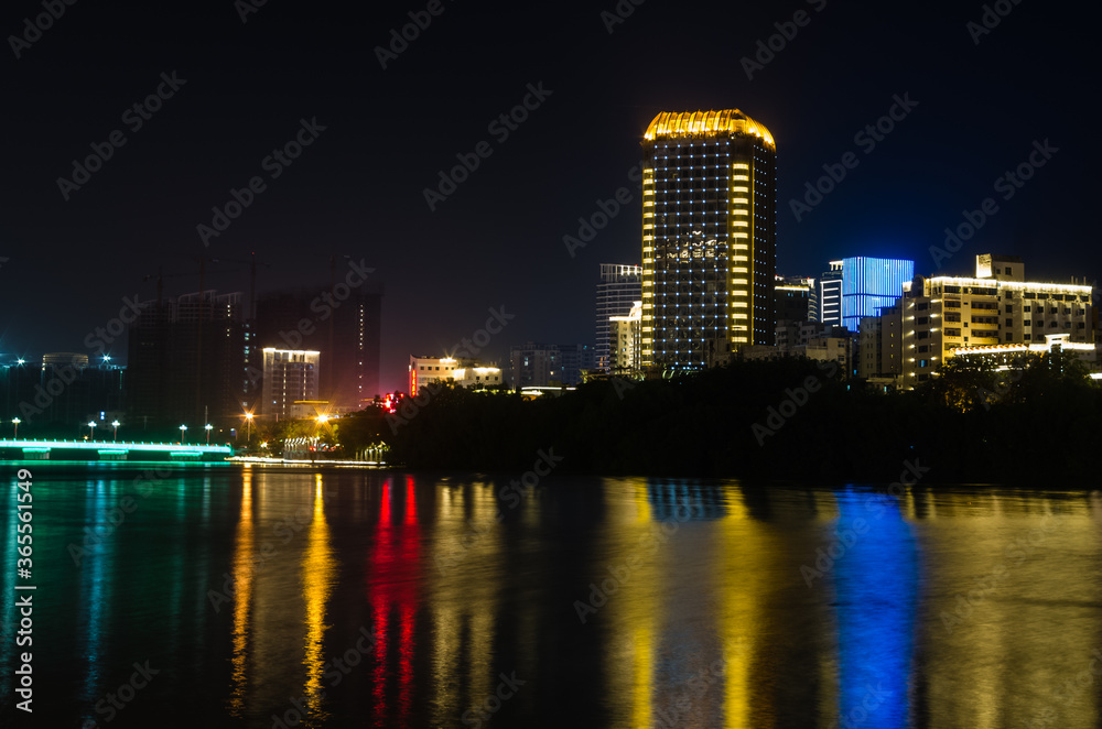 Fototapeta premium Night panorama view of Sanya city on Hainan island, China
