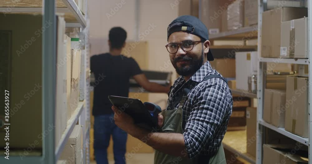 Young man working in distribution center Young man working in distribution center