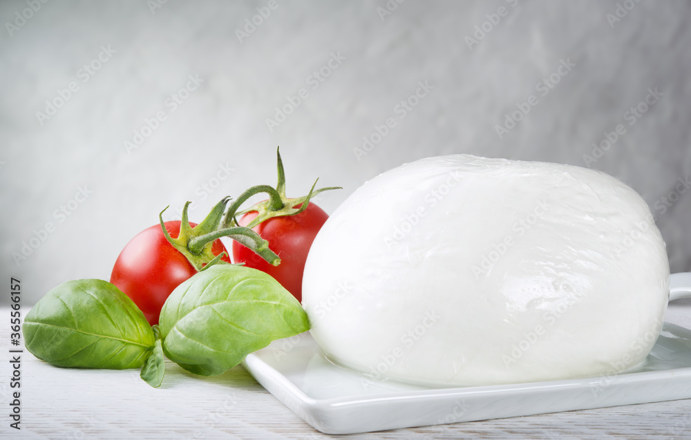Buffalo mozzarella with tomato and basil, Space for text. Buffalo mozzarella with tomato and basil, Space for text.