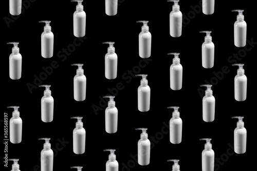 colorful pattern of vials on a black background top view . covid-19 antivirus