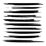 Long textured strokes of black paint isolated on white background