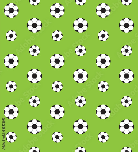 Vector seamless pattern of flat cartoon football ball isolated on green background