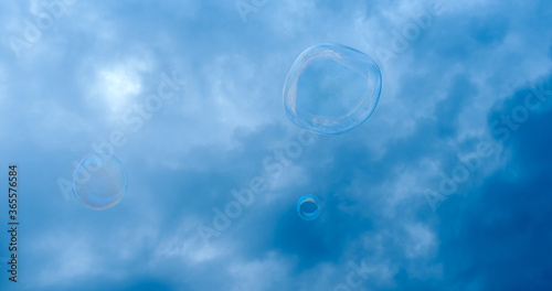 soap bubble against the background of a stormy dark blue sky