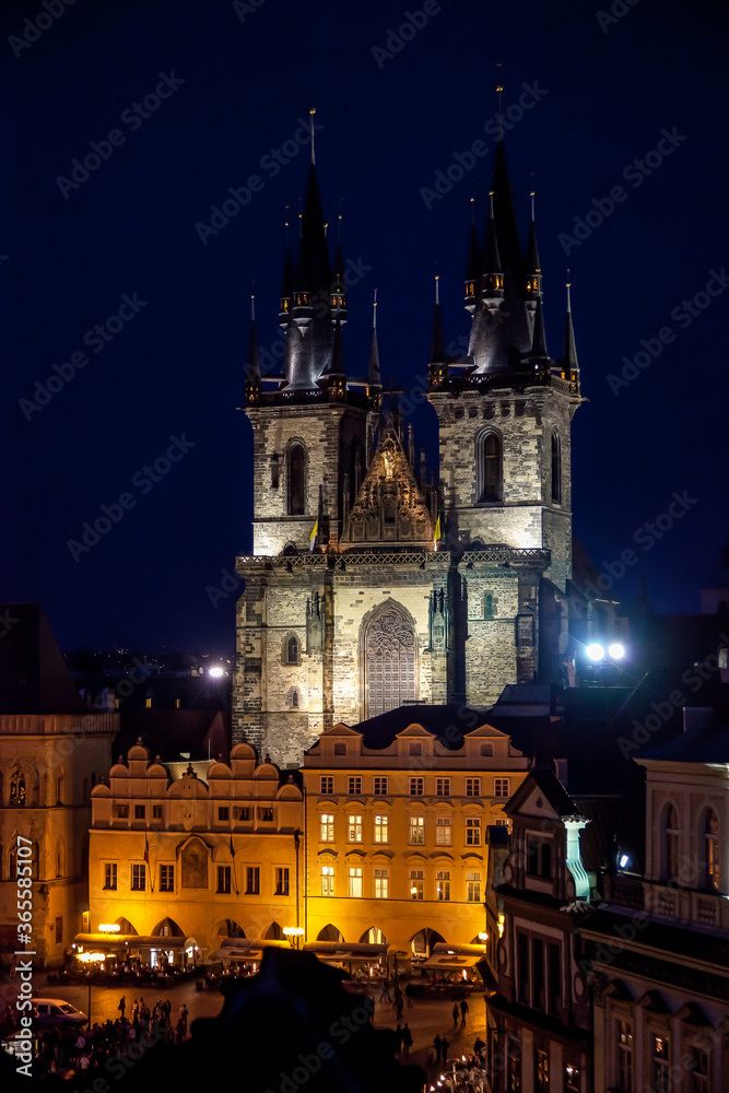 Prague Tyn Cathedral in evening over the rooftops