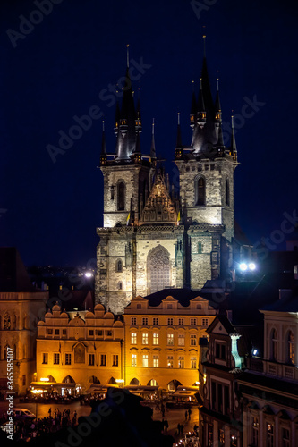 Prague Tyn Cathedral in evening over the rooftops
