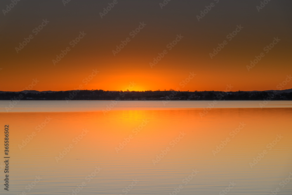 Sunset over the Lake with Clear Skies
