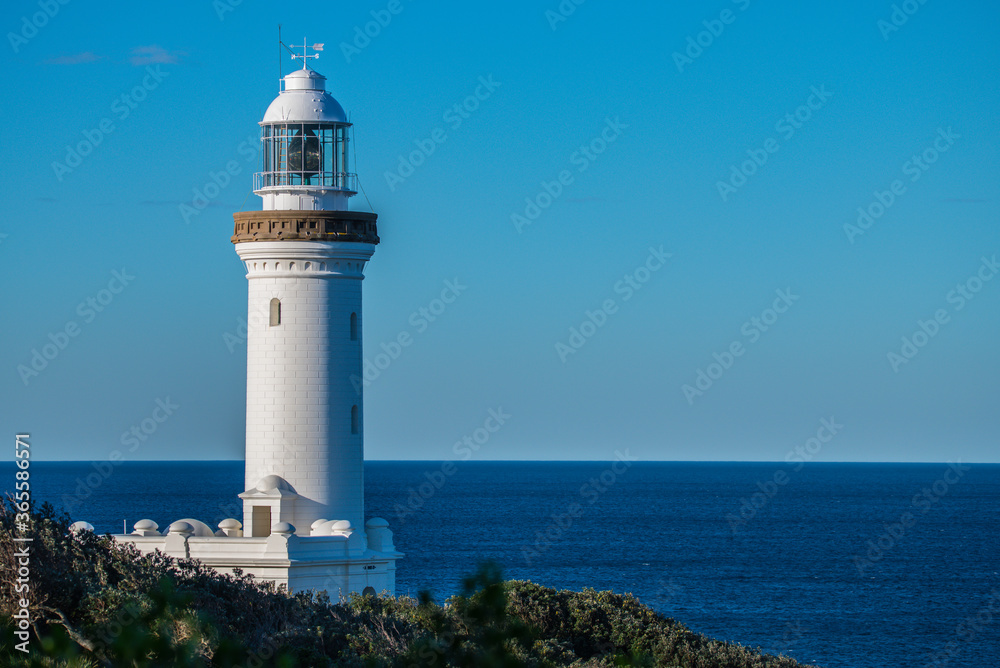 Norah Head Lighthouse with a clear blue sky