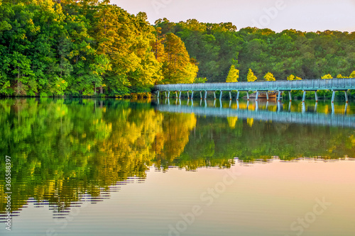 Fototapeta Naklejka Na Ścianę i Meble -  Reflection of bridge over lake at sunset