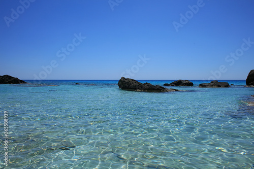 Kedrodasos beach private paradise blue lagoon free camping area rocky coast with crystal waters and corals covid-19 season prints photo