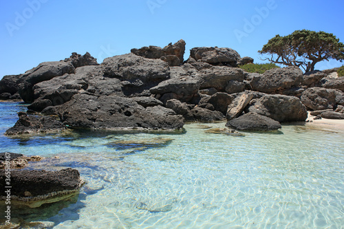 Kedrodasos beach private paradise blue lagoon free camping area rocky coast with crystal waters and corals covid-19 season prints photo